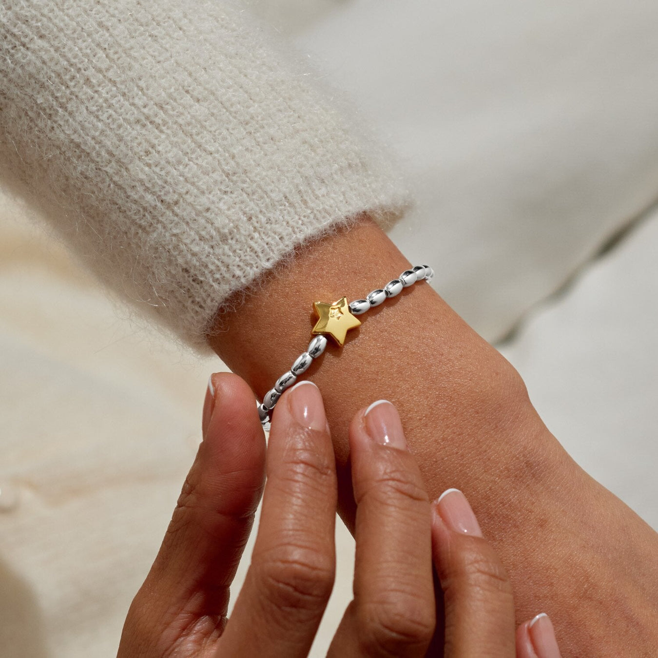 Joma Merry Christmas bracelet worn on wrist