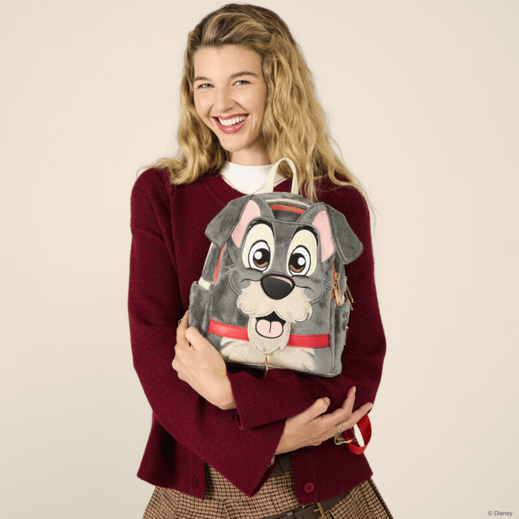 Model holding Disney Loungefly Tramp Plush Cosplay Mini Backpack showing the soft grey character design