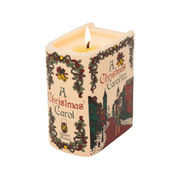 Lit A Christmas Carol scented ceramic candle with visible flame, illustrated cover and decorated book spine