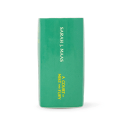 Side spine of A Court of Mist and Fury green ceramic book candle showing Sarah J Maas and book title