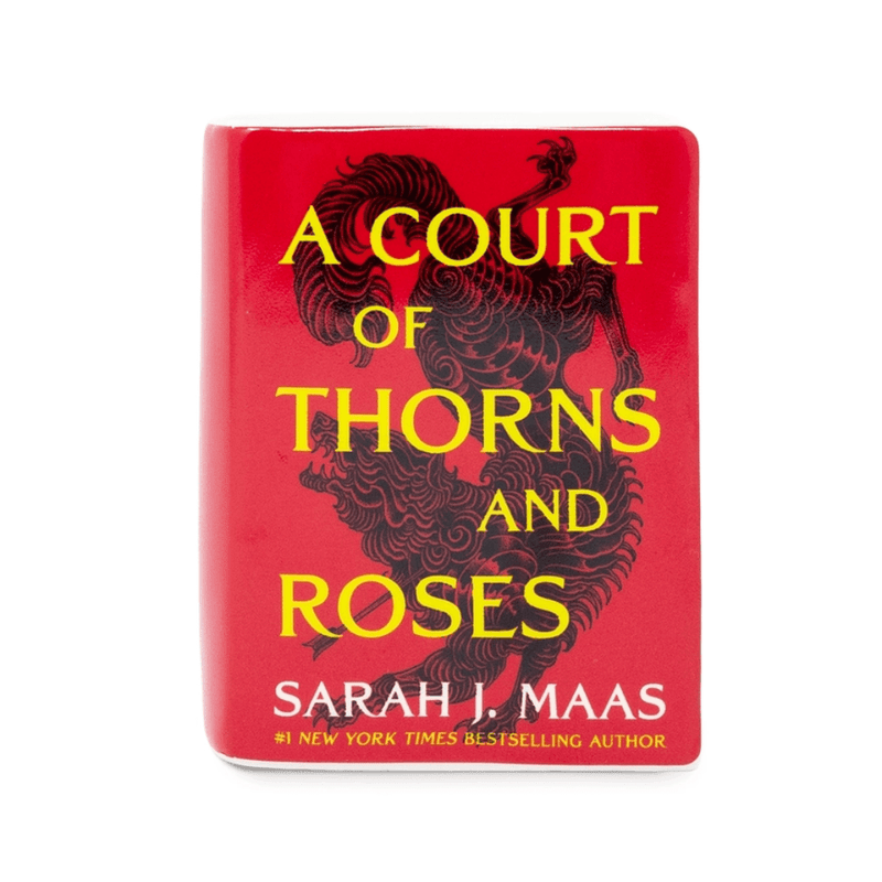 Front cover of A Court of Thorns and Roses red ceramic book candle by Sarah J. Maas