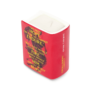 Angled rear view of red Sarah J. Maas book candle showing white wax, wick and printed quote