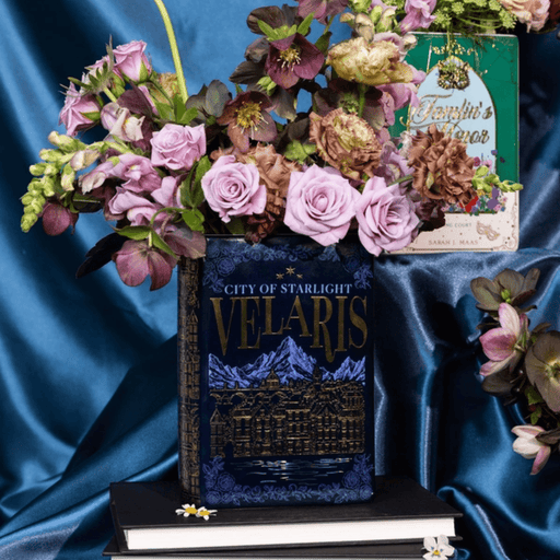 ACOTAR Night Court large book vase filled with flowers and styled on a stack of books