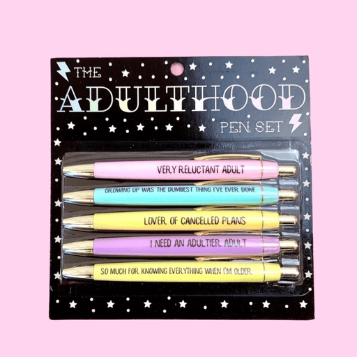 Adulthood pen set on starry black card with 5 black-ink ballpoints in pastel colours printed with funny adulting phrases.