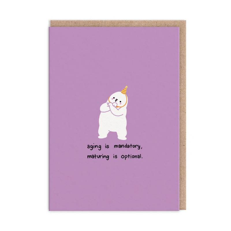 Cheeky Ageing Is Mandatory birthday greeting card with cartoon person wearing yellow party hat on lilac background
