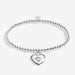 Full view of Joma Jewellery A Little Amazing Mum To Our Family Bracelet, silver-plated beaded stretch Bracelet with heart charm.