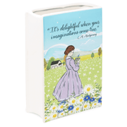 Rear angle highlighting meadow artwork and daisies on the ceramic book vase


