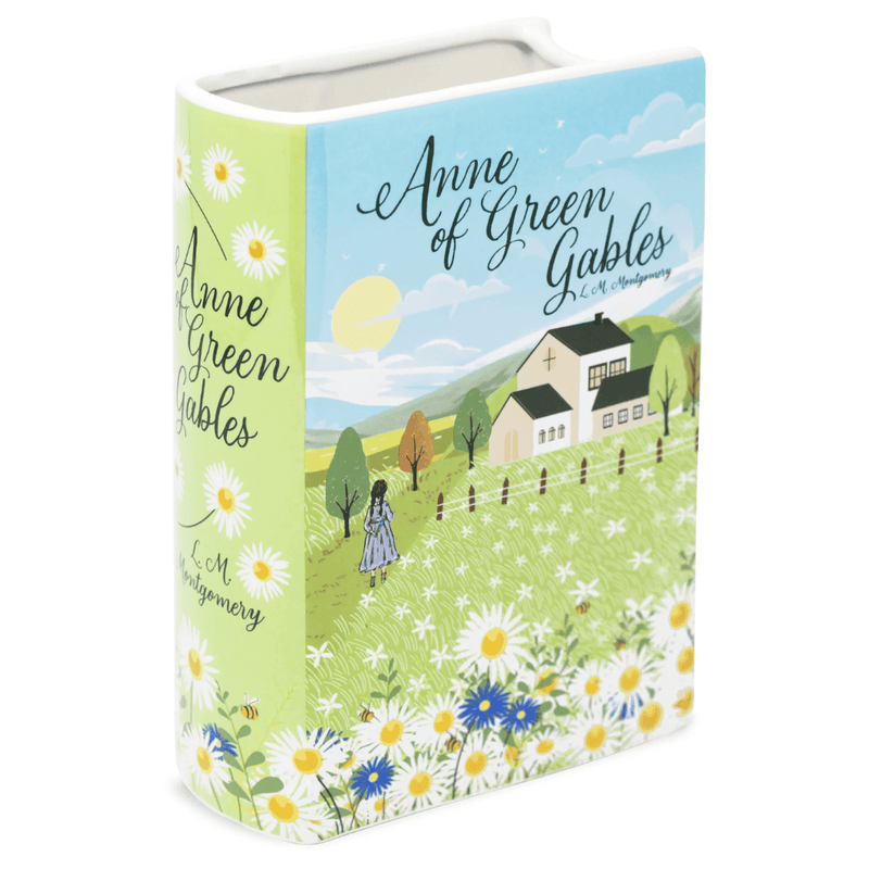 Angled product shot of Anne of Green Gables ceramic book vase with Green Gables house scene

