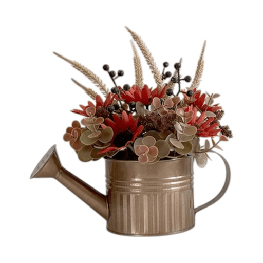 Front view of a 23 x 23cm autumn floral arrangement in a copper-look watering can on a white background.