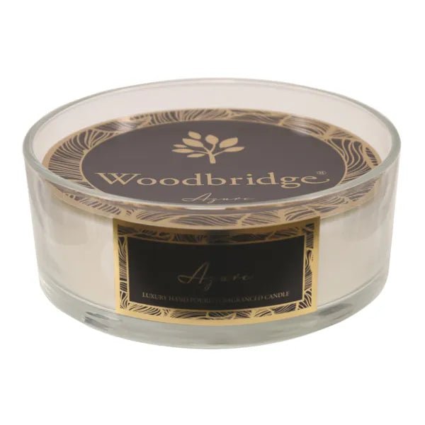 Azure 5 wick candle in a clear glass bowl with black and gold label

