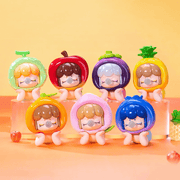 Full set of Baby Nanci Fruits figures lined up on orange background

