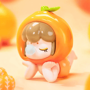 Orange-helmet Baby Nanci dozing on tummy, glossy peel finish – Fruits Series Blind Box
