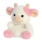 Angled view of Belle Strawberry Cow plushie highlighting pink ears and hooves
