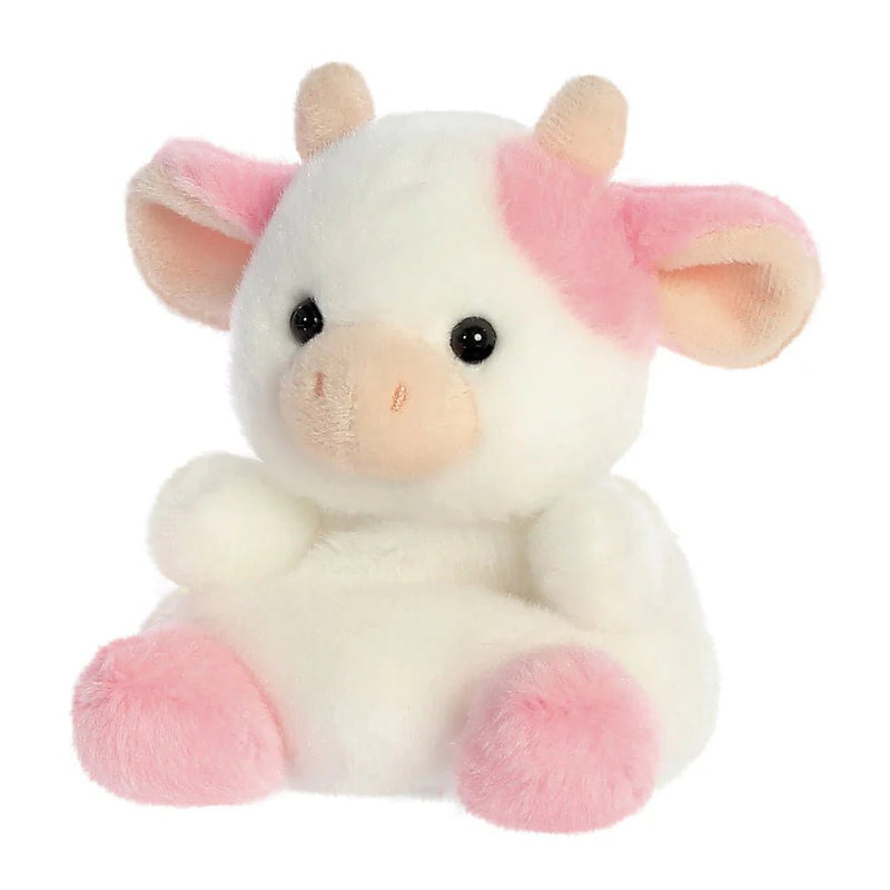 Angled view of Belle Strawberry Cow plushie highlighting pink ears and hooves
