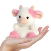 Belle Strawberry Cow Palm Pals plushie resting in a hand, showing its 13 cm palm size

