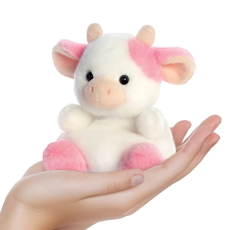 Belle Strawberry Cow Palm Pals plushie resting in a hand, showing its 13 cm palm size
