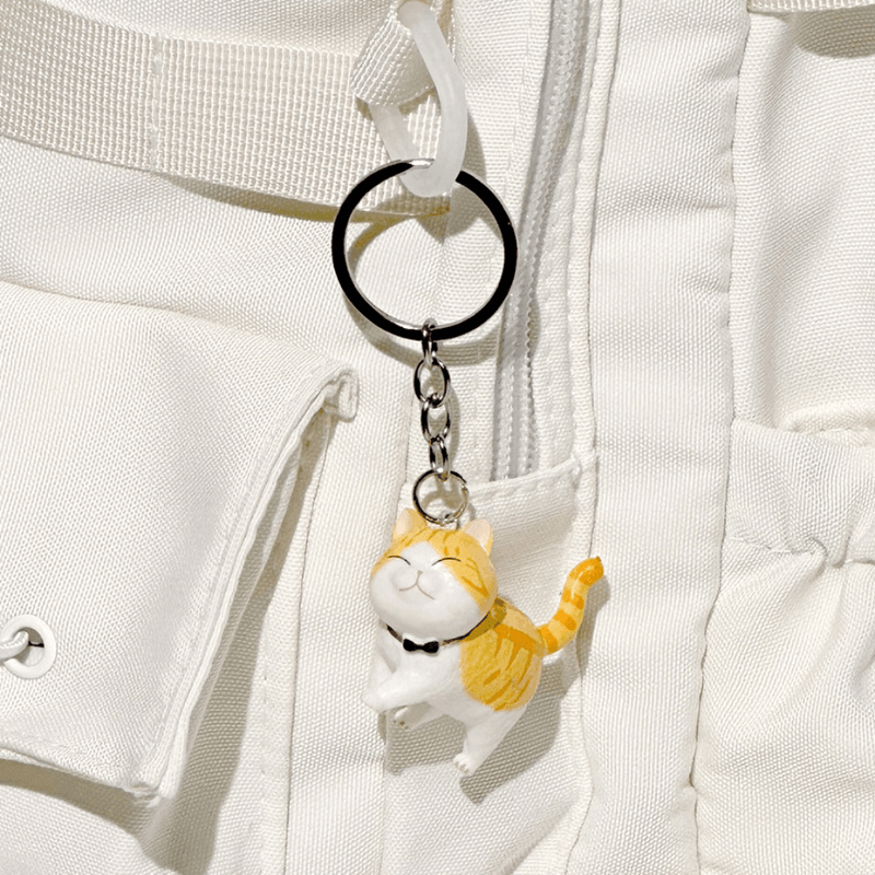Best Friend Cat Figure Collectable Keyring Random Box orange tabby cat charm attached to a white backpack