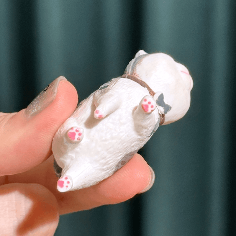 Best Friend Cat Figure Collectable Keyring Random Box close-up showing the underside paw detail of a white and grey cat figure