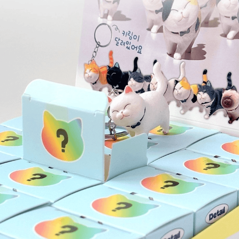 Best Friend Cat Figure Collectable Keyring Random Box display with a white cat figure popping out of an opened mystery box
