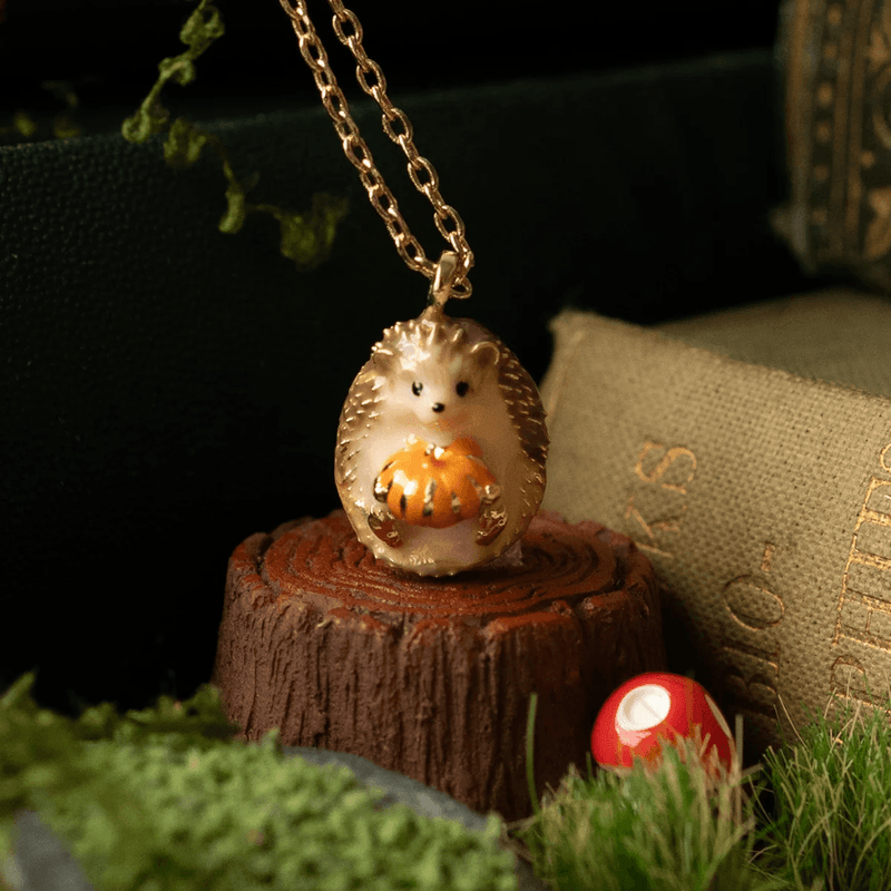 Bill Skinner hedgehog and pumpkin pendant necklace lifestyle detail