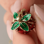 Green enamel leaf detail on Bill Skinner strawberry locket