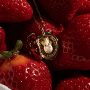 Bill Skinner Strawberry & Mouse Locket Necklace with fresh strawberries