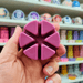 Purple Black Cherry segmented wax melt held in hand, close-up lifestyle photo showing six wax melt sections