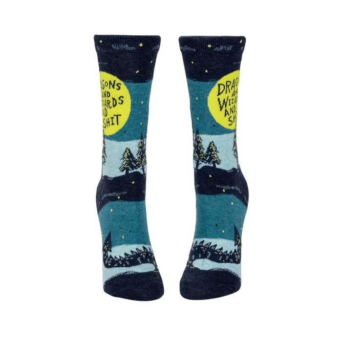 Front view of Blue Q womens crew socks, teal and navy with dragon tail, pine trees and Dragons and Wizards and Shit text.