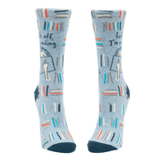 Front view of Blue Q F*** Off I’m Reading socks with book stacks and cat motif