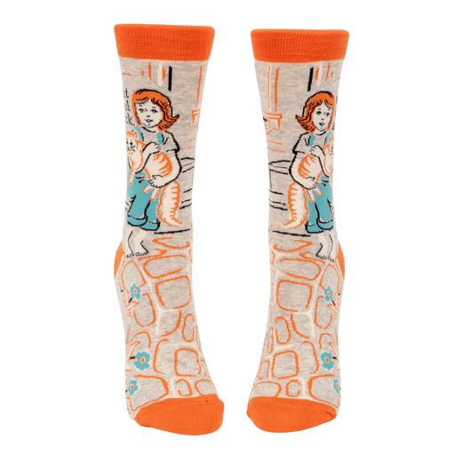 Angled view of Blue Q crew socks showing the slogan my cat is cool as fuck with orange accents and cat graphic