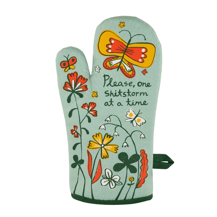 Front of Blue Q oven mitt - Please, one shitstorm at a time 