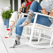 Blue Q People I Love: Cats women’s crew socks in grey with cat pattern, porch lifestyle shot