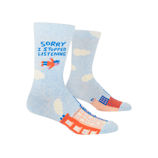 Blue Q Sorry I Stopped Listening men’s socks, angled view showing sky and city design.