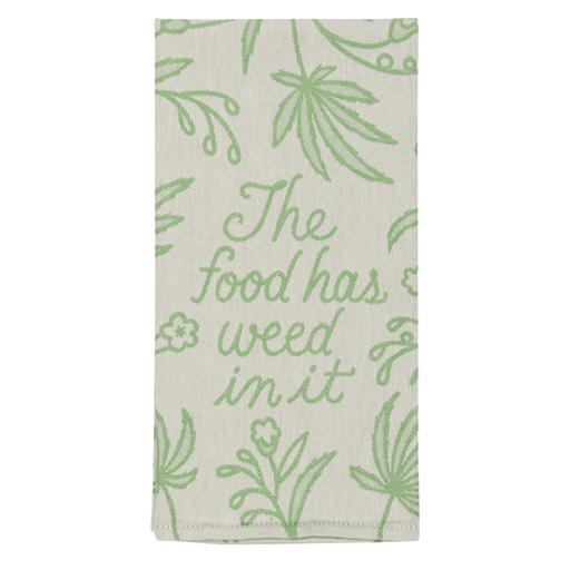 Folded Blue Q tea towel showing the phrase The food has weed in it in green script