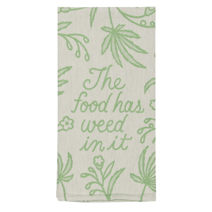 Folded Blue Q tea towel showing the phrase The food has weed in it in green script