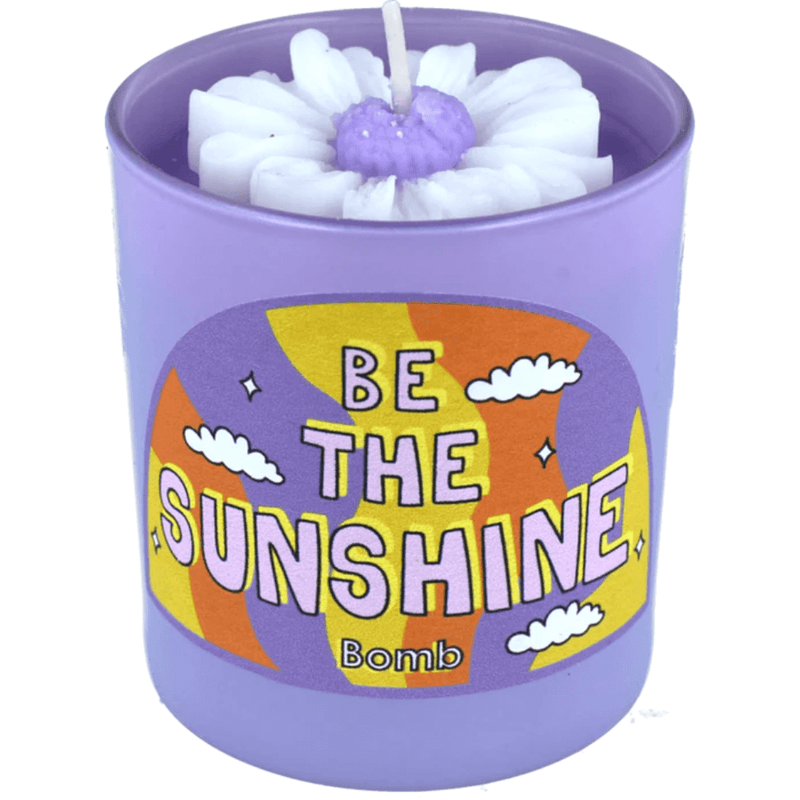 Bomb Cosmetics Be The Sunshine flower candle—lavender jar with white wax daisy, lavender-geranium scented candle.