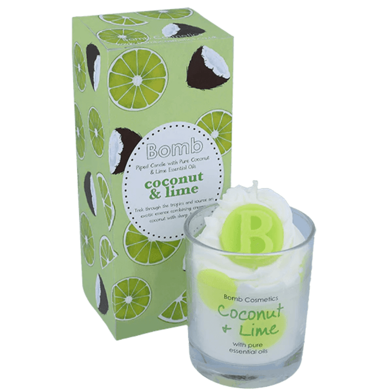 Bomb Cosmetics Coconut & Lime piped scented candle—white whipped wax with lime topper in glass jar, beside green lime-print gift box.