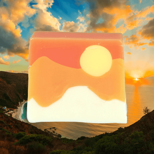 Bomb Cosmetics Here Comes the Sun Soap Slice styled against a warm sunset sky background