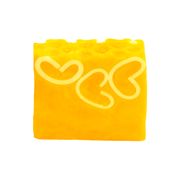 Bomb Cosmetics Honey Bee Good Soap Slice on a white background with yellow colour and heart design