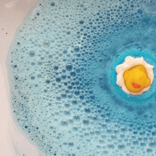 Bomb Cosmetics Pool Party Bath Blaster fizzing in the bath creating blue water with a duck topper