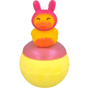Bomb Cosmetics Snuggle Duck Bath Blaster with bunny hat duck topper and yellow bath bomb on a white background