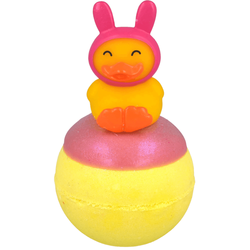 Bomb Cosmetics Snuggle Duck Bath Blaster with bunny hat duck topper and yellow bath bomb on a white background