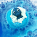 Bomb Cosmetics Splash! Bath Blaster fizzing in the bath creating deep blue water with a whale topper