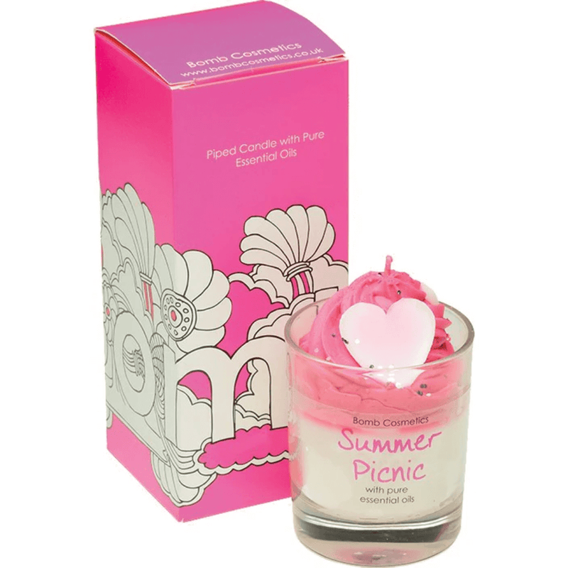Bomb Cosmetics Summer Picnic piped scented candle—pink whipped wax with heart topper, beside matching ombré pink gift box.
