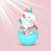 Bomb Cosmetics Unicorn Stardust Bath Blaster with unicorn topper on a blue bath bomb against a soft rainbow background