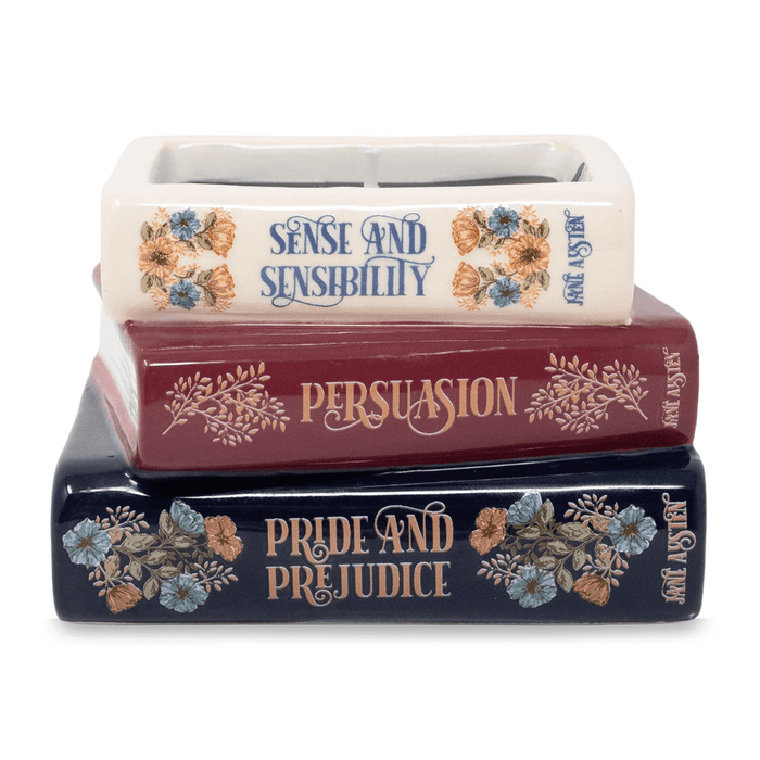 Front view of Jane Austen book stack shaped candle with literary title details
