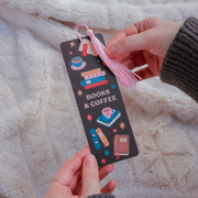 Books and Coffee bookmark held in hands showing colourful book and coffee design