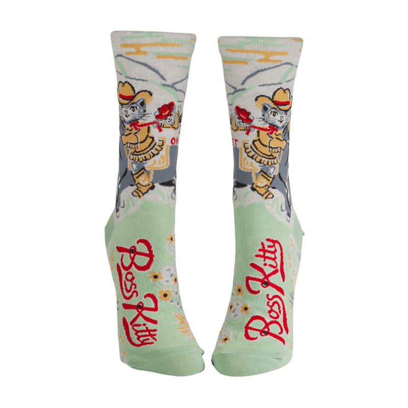 Front view of novelty socks with cowboy cat, red “Boss Kitty” lettering, and western theme.