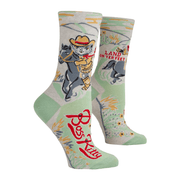 Mint green crew socks featuring a cowboy cat riding a horse with the phrase “Land on yer feet.”