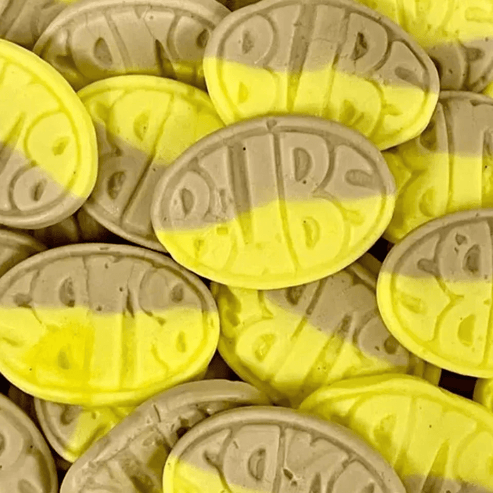 Close-up of Bubs Sweet Ovals Banana Toffee sweets in yellow and brown oval pieces